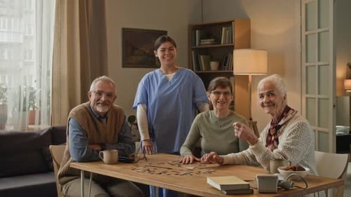 Seniors doing a puzzle in a bright living room