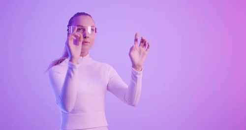 Futuristic Woman Interacting with Virtual Reality Display