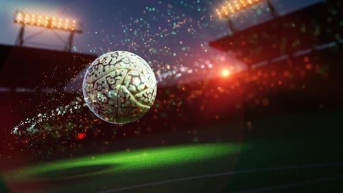 Ornate white football flying through stadium lights.