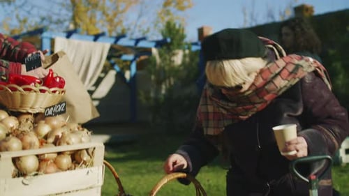 Woman Shops at Outdoor Vegetable Market