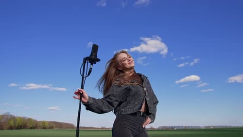 Young Woman Singing Outdoors on Beautiful Sunny Day