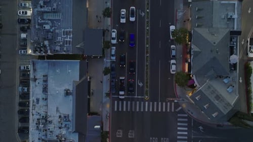 Top Down Shot of Crossroads and Traffic in Streets of City at Dusk Vehicles Standing at Traffic