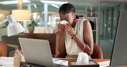Woman, laptop and sneeze in office with tissue for influenza, sinus infection and data analysis