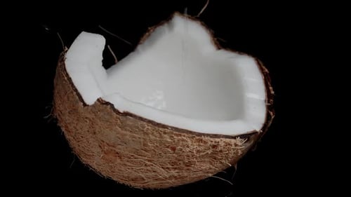 Close Up of Coconut with Water Pouring