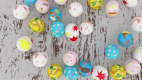 Colorful Decorated Easter Eggs Creating Frame Border on Rustic