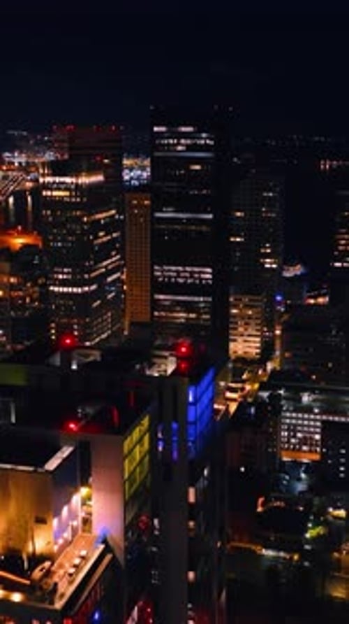 New York city in summer night. Aerial shot of american city building in night. Vertical video
