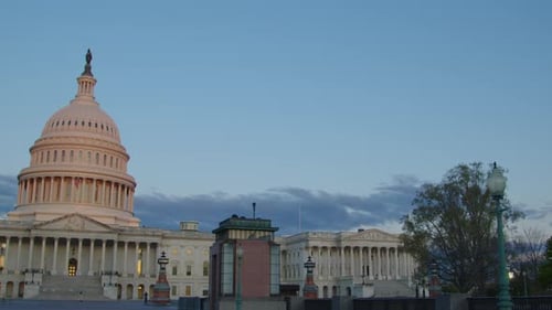 The camera slowly pans left and centers on the United States Capitol building in Washington DC. Earl