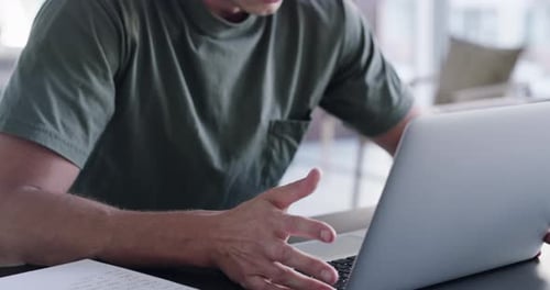 Frustrated Man Using Laptop Computer at Home