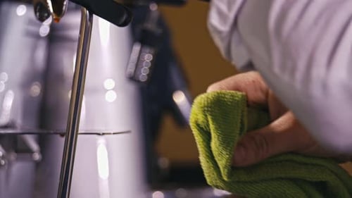 Cleaning Steam Wand on Espresso Machine Close Up