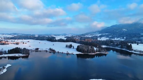 Flying over the river to the other bank covered with snow.