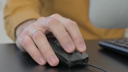 Close up of Hand Using Computer Mouse for Work