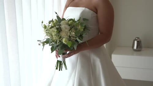 Adult Holding Wedding Bouquet in Daylight