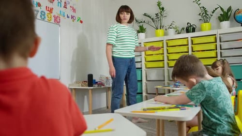 During a Lesson in Primary School the Teacher Gives Tasks to Students
