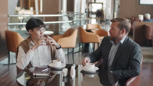 Ethnically Diverse Businessmen Having Coffee Break