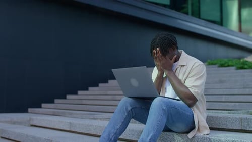 Stressed Man Facing Financial Crisis Outdoors