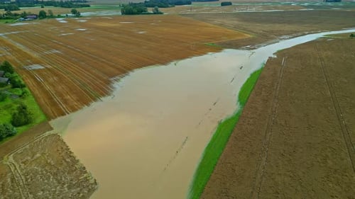 Flooded agriculture farm land field, natural disaster crop under water, aerial