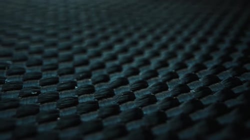 Imagen macro de un material de fibra de carbono entrelazado
