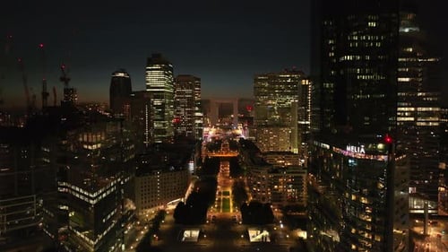 Aerial Ascending Footage of Modern Urban Borough La Defense at Night Park and Pedestrian Boulevard