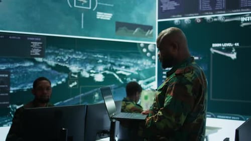 Cybersecurity Team Operates in an Advanced Military Command Center