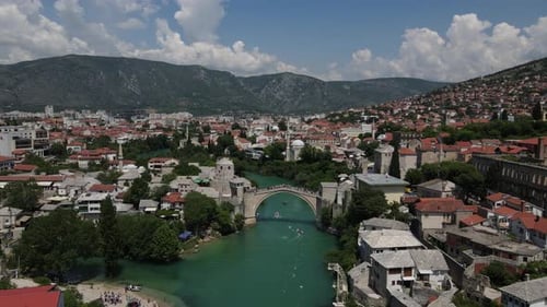 Water sports drone view on the river in Mostar city, an example of Ottoman architecture in Bosnia