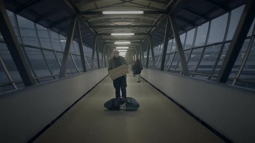 Elderly Homeless Man Suffering From Poverty Looking for Help at Train Station