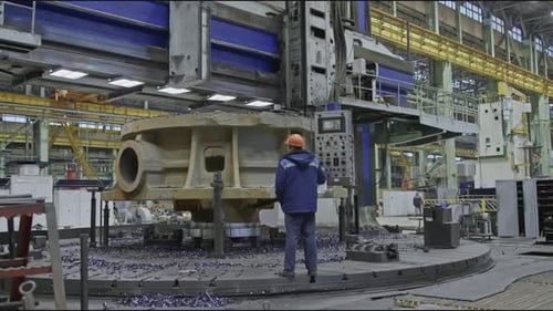Worker with Remote Control and Rotating Lathe Stock Clip Worker with Control Panel for Factory