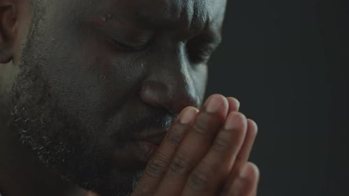 Man Praying With Hands Together Close Up