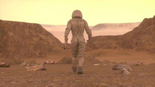 Astronaut Walking Alone on Rocky Martian Surface Under Orange Sky