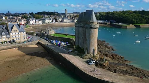 Solidor tower and beach at Saint-Malo, Brittany in France. Aerial drone flyback and vertigo effect