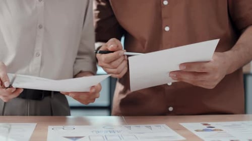 Office Coworkers Analysing Documents
