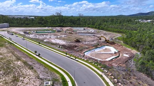 Aerial View of Construction Site Near Greenery