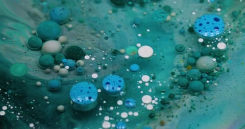 Abstract Blue and White Bubbles Floating in Liquid
