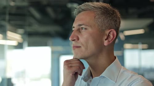 Businessman Deep in Thought in Modern Office