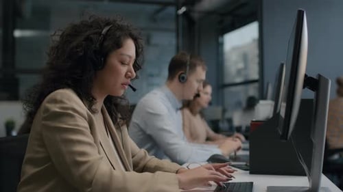 Diverse call center team at modern office offers friendly customer service
