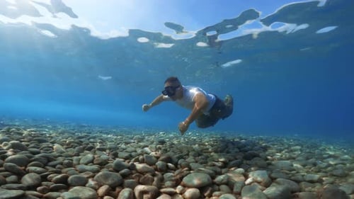 Soldier Swims Underwater in the Sea