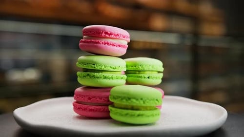 Close-up, bakery - a pyramid of delicious colored macaroons on a rotating surface