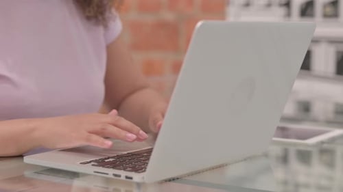 Close Up of Female Hands Typing on Laptop