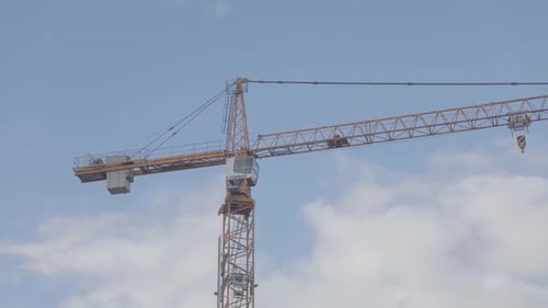 Time-lapse of the crane with a nice blue clouded sky.