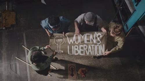 Top View Portrait of Women with Womens Liberation Poster at Factory