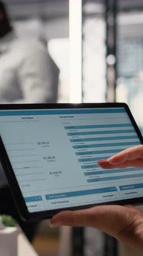 Vertical Video Woman Property Engineer Searching Layout Details on Laptop in the Office