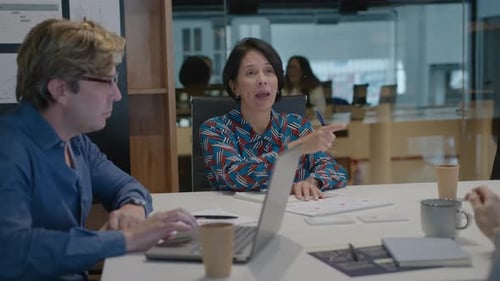 Adults collaborate in a Modern Office Meeting