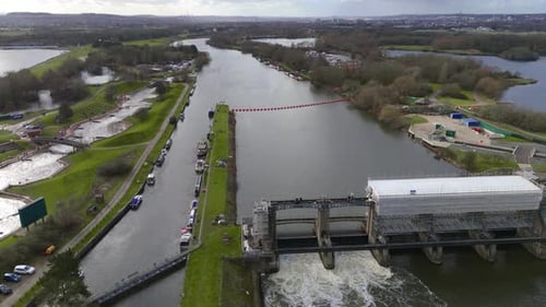 Sluice barrier structure on a countryside river drone birds eye view