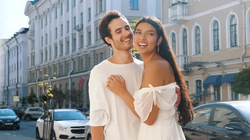 Loving Couple Embraces on Sunny City Street