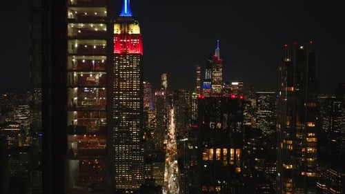 Empire State Building Towers Over Midtown Manhattan and New York City Skyline with Its Patriotic