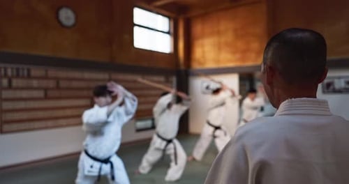 Martial Arts Students Practicing in a Dojo