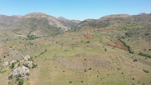 Aerial View Of Green Hills And Mountain Village