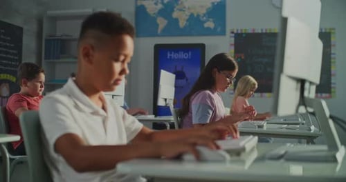 Children Learn Computer Skills in a Classroom