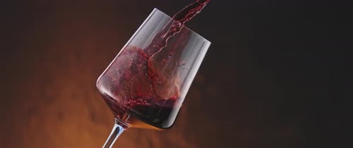 Wine being poured into a glass