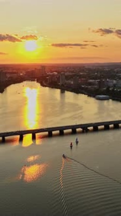 Sunset over the Charles River and Boston skyline in a vertical view