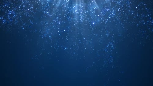 Falling Christmas Particles on Blue Background